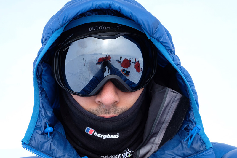 Camp reflected in goggles